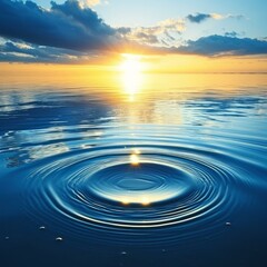 Canvas Print - b'Sunset over calm water with a single droplet creating ripples'