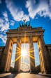 b'The Brandenburg Gate illuminated by the sun'