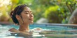 Asian Woman in Onsen with Serene Expression, Stress Relief and Solitude, Holistic Health Spa - Hospitality, Wellness Industry.