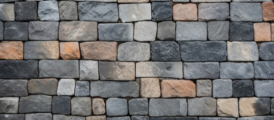 Canvas Print - Close up of a brick wall with various colored bricks forming a geometric pattern