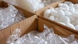 © Jeerawut - visually appealing image of various packing peanuts, bubble wrap, and air pillows filling a box, showcasing their protective and space-saving qualities.