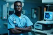 A black radiology technician standing in front a workstation adult nurse stethoscope.