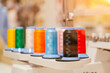 spools of colored thread installed on an automatic digital sewing machine