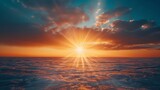 Fototapeta Zachód słońca - Close-up of sun rays peeking over the horizon, heralding the dawn of a fresh beginning