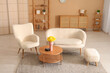 © Pixel-Shot - Modern interior of living room with sofa, armchair and daffodil flowers