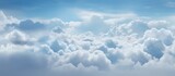 Fototapeta  - A plane flying in a cloudy sky