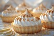 Lemon meringue cupcakes with lemon slices on a table. Perfect for bakery or dessert concept
