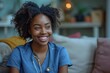 © Larisa AI - An African American nurse in blue scrubs smiles warmly, embodying care and professionalism