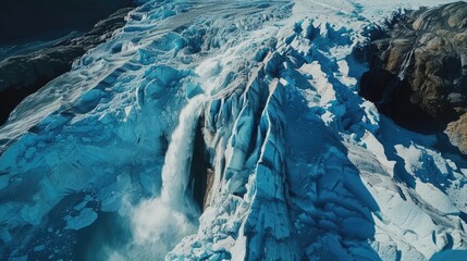 Canvas Print - A large glacier with a waterfall cascading out of it. Ideal for nature and landscape themes