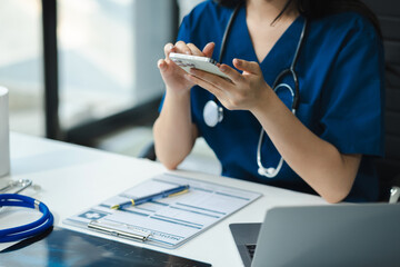 Wall Mural - Medical Technology Concepts. The doctor is working on a tablet digital tablet computer in office  in the morning at the desk.