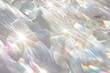 White background with bright iridescent sunlight flares and colorful refractions