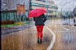 Pedestrian on the street with an umbrella in rainy days in winter season