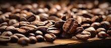 Close-up Of Coffee Beans On Wooden Surface