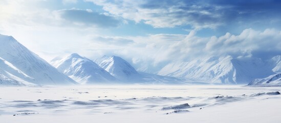 Aufkleber - Snowy mountains under a blue sky with clouds