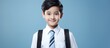 Young boy in tie with backpack