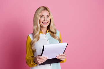 Sticker - Photo of cheerful cute lady wear trendy clothes hold paperholder read weekly plan tasks isolated on pink color background