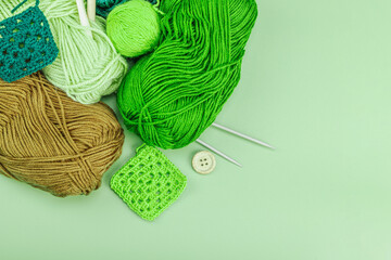 Wall Mural - A set of knitting yarn and tools in spring colors. Handmade concept, creative art, crafting process