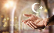 Hands and islamic symbol floating with glitters and religious background