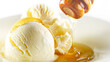 Honey pouring over scoops of creamy vanilla greek yoghurt ice cream with nutsi. Delicious refreshing dessert
