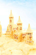 Sendcastles on a sunny beach with blue sky. Concept of leisure, holiday, vintage nostalgia memory