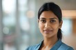 © Anastasiia - Young Indian businesswoman in corporate office setting with a professional headshot using technology enhancements. Concept Professional Headshot, Indian Businesswoman, Corporate Office