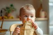 Mockup with a baby and packaging for baby food and healthy eating. A newborn sits at the table and holds a package of food in his hands in front of him. Space for text, pastel tones, little boy.
