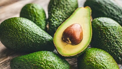 Wall Mural - green ripe avocado top close up view texture vegan healthy food background diet organic vegetable poster photo