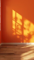 Contemporary orange wall backdrop in minimalist room with brown parquet floor and copy space