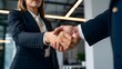© Rsquare stock - close-up of Handshake between two businessmen and women, handshake after deal, handshakes after meeting