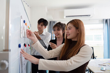 Wall Mural - team of creative ux developer and ui designer brainstorm about app interface design at modern office