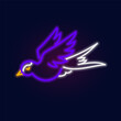 Fashion bird swallow, neon sign. Night bright signboard, Glowing light. Summer logo, emblem for Club or bar concept