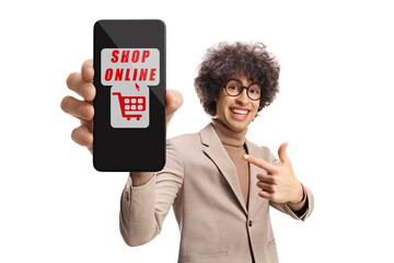 Poster - Happy young man with curly hair pointing at a smartphone with online shopping app