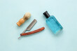 Male beauty products with perfume and barber tools, top view