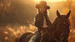 Dziewczynka w kapeluszu jadąca na koniu podczas zachodu słońca