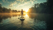 © senadesign - A woman paddling a stand-up paddle board on a calm lake.