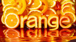 Appetizing orange juice and fruit slices cut out into letters and arranged to form the word 'orange' in a creative typography style.