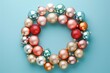 Pastel Pink and Blue Christmas Bauble Wreath on Blue Background