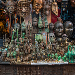 African goods and wooden hand made merchandise on sale in a market in Old town of Marrakech, Morocco.