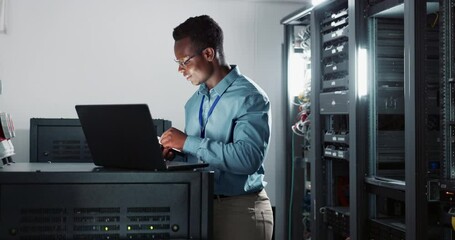 Wall Mural - Laptop, coding and man engineer in server room for software, cybersecurity or programming. Professional, computer and African male technician working with online database with technology in office.