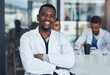 © peopleimages.com - Portrait, black man and doctor in hospital, healthcare and physician for medical health staff. Professional, expert or surgeon with stethoscope, male and cardiologist for case research with colleague