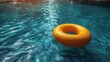 A yellow rubber ring floats in a pool of water