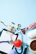 Veterinary table with accessories and pet toys on blue background