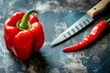 © STOCK IMAGES STALL - Red bell pepper closeup with a knife at the right side. Healthy food concept. Vegeterian cousine.