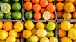 A colorful array of citrus fruits, including oranges, lemons, and limes, arranged in baskets at a supermarket for customers to enjoy their refreshing flavors.
