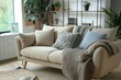Cozy beige sofa with cushions and a knit throw in a plant filled room