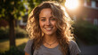 Sunlit Curly Hair Young Woman with a Bright Cheerful Smile