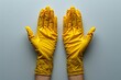 Clean rubber gloves protect golden buddha statue