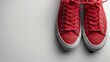 Simple vibrant red shoelace on a clear white background minimal style with ample text space