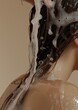 Woman washing her hair adult hairstyle splashing.