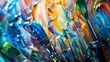 A chaotic mix of paintbrushes and tubes of paint with a defocused background of swirled and blended hues. .